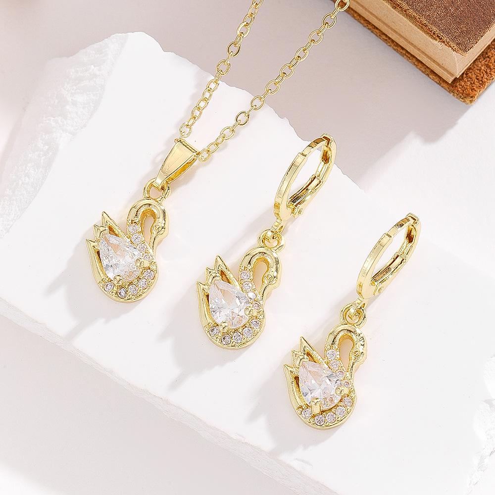This Elegant Three-piece Set of Swan-shaped Copper Pendant Necklace and Earrings Is a Versatile Fashion Accessory for Women, Featuring a Geometric