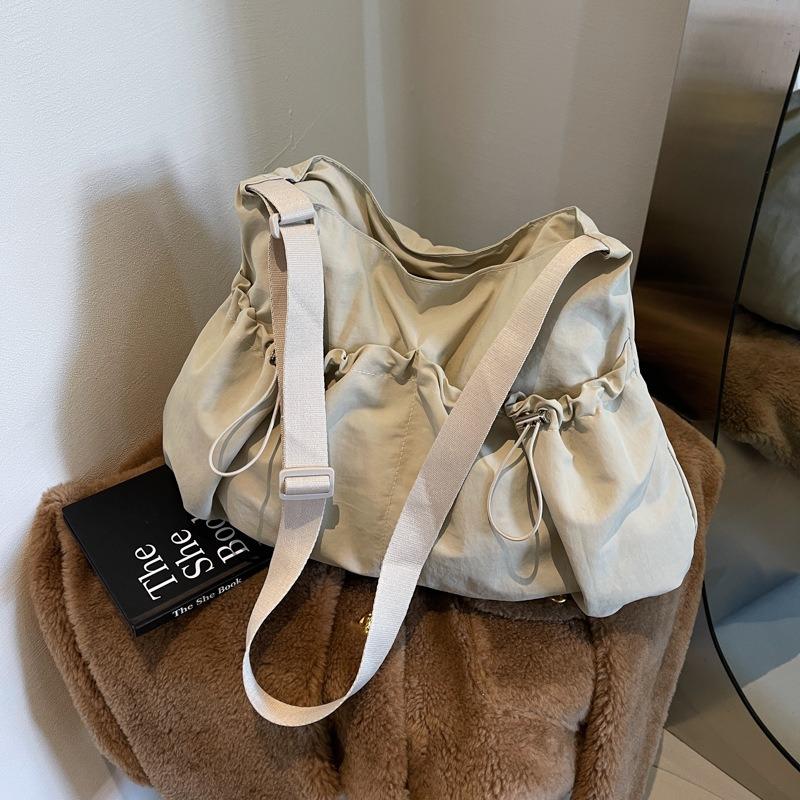 Women's Niche Casual Drawstring Shoulder Bag Light Firm Large Capacity Class Crossbody Tote Bag Portable