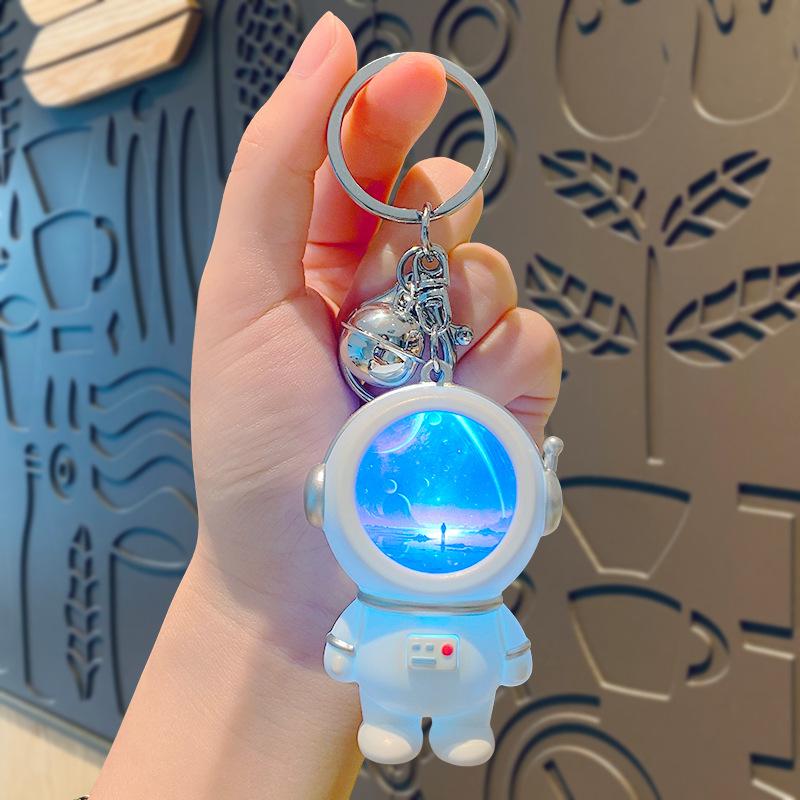 Creative Astronaut Starry Sky Keychain Pendant: Cartoon Doll Schoolbag Decoration, Perfect for Students or Couples.