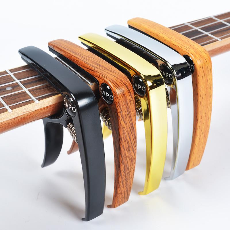 Zirconium Alloy Wood Grain Metal Capo: Multifunctional Transposition Clip for Guitar and Ukulele.