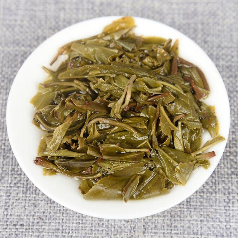 Yunnan Pu'er Tee Frühlingstee Roh Tee 100g Kuchentee Isländischer Roher Kuchentee