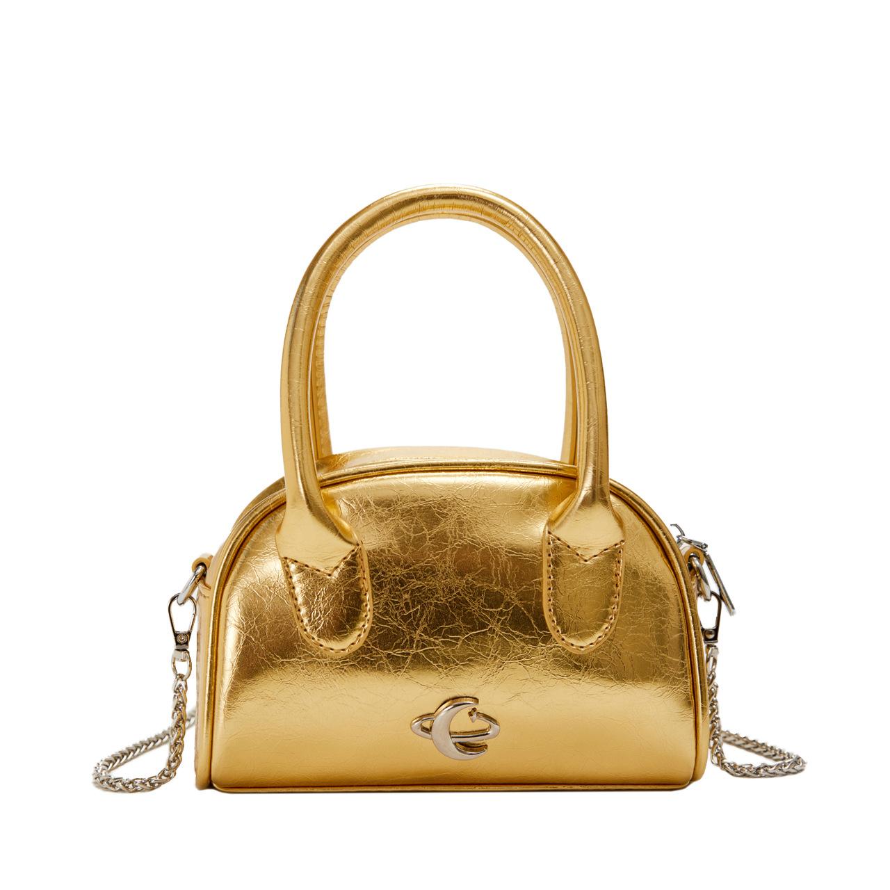 

This year s new trendy high-end light luxury portable Boston bag niche design versatile solid color messenger women s bag золотой