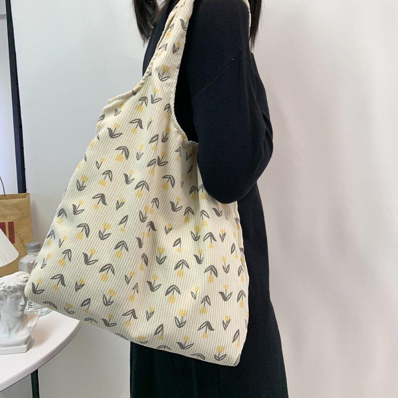 

Вместительная сумка-тоут через плечо для поездок на работу