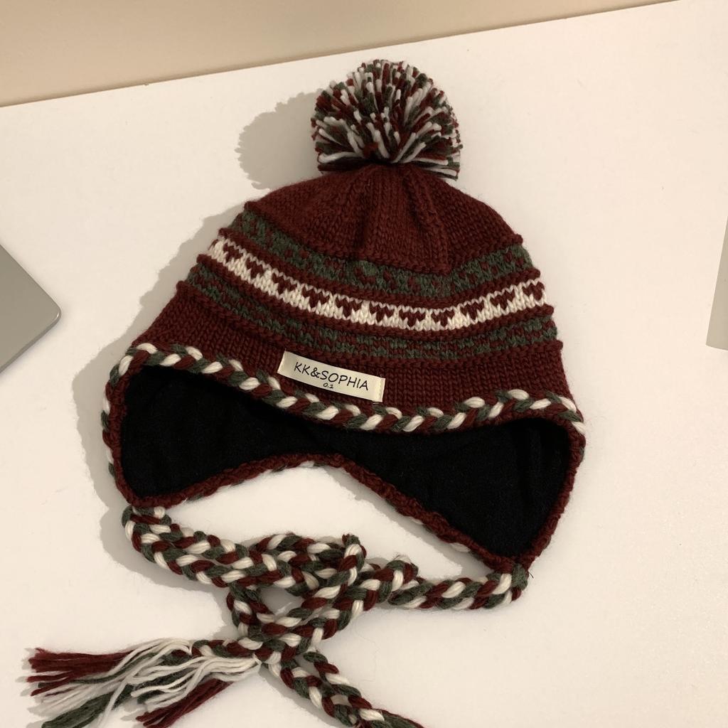 Cozy Chic Knitted Winter Hat For Women Featuring Colorful Pom Poms And Warmth