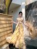 Beautiful seaside vacation style yellow floral suspender dress women's waist long dress temperament Hainan Sanya beach dress