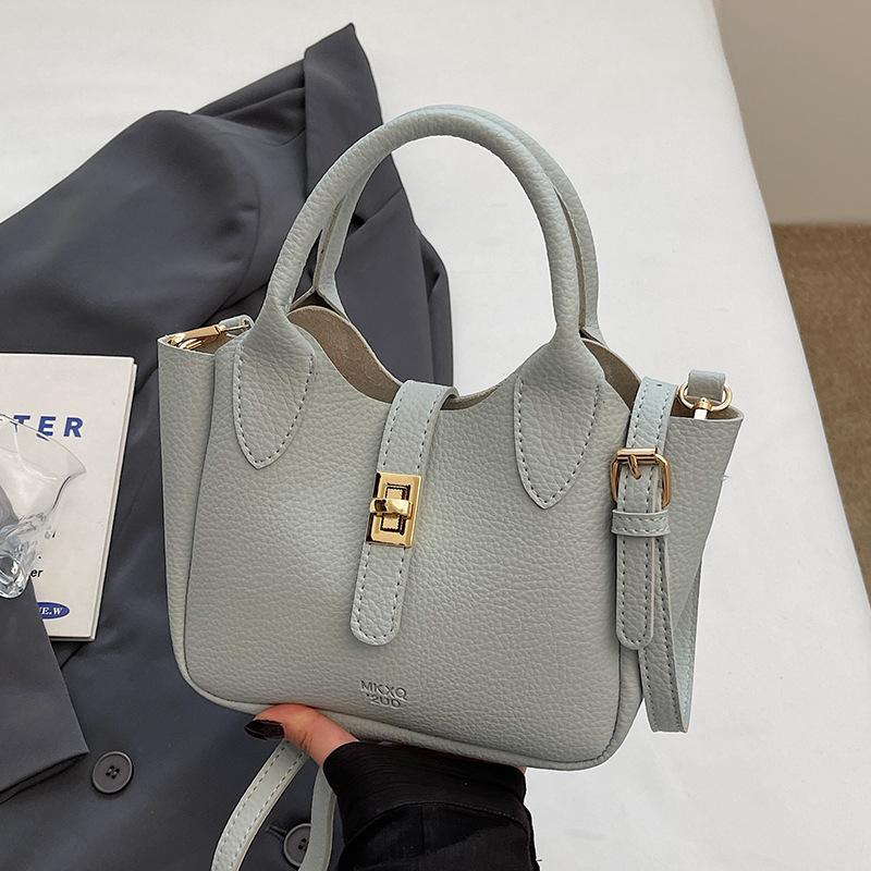 Wholesale hot sale simple temperament light luxury lychee pattern portable bucket bag niche design versatile commuter messenger bag