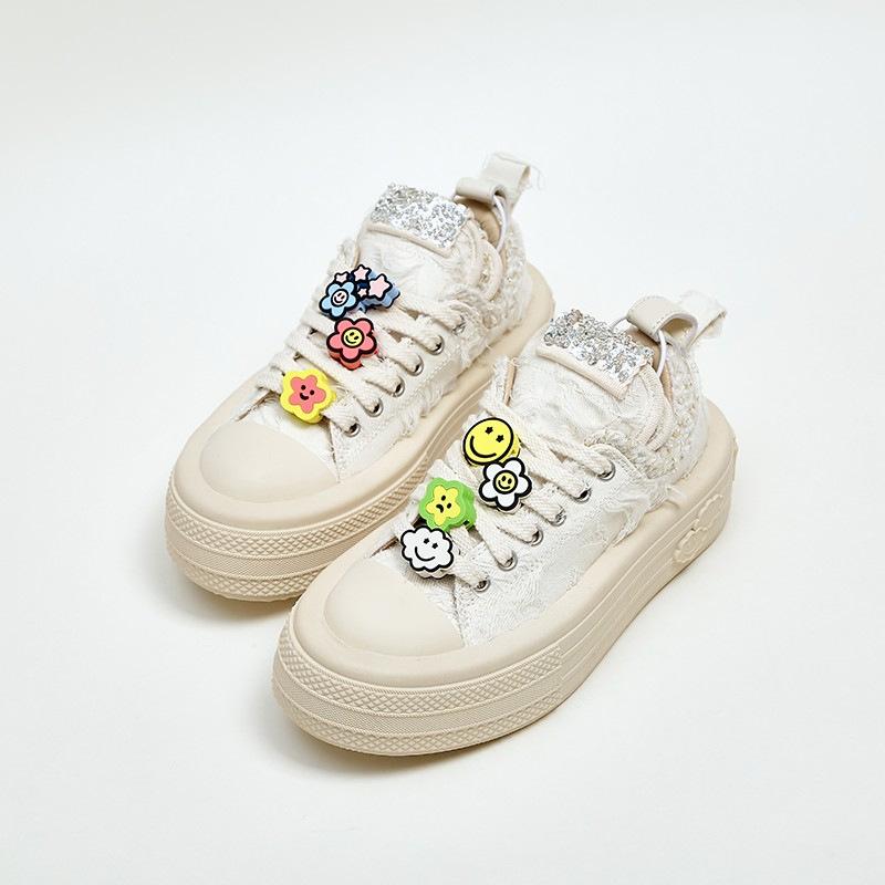 Zhao Ruth's new niche thick-soled pendant smiley face shoes of the same sports and leisure shoes increase the height of canvas shoes for women