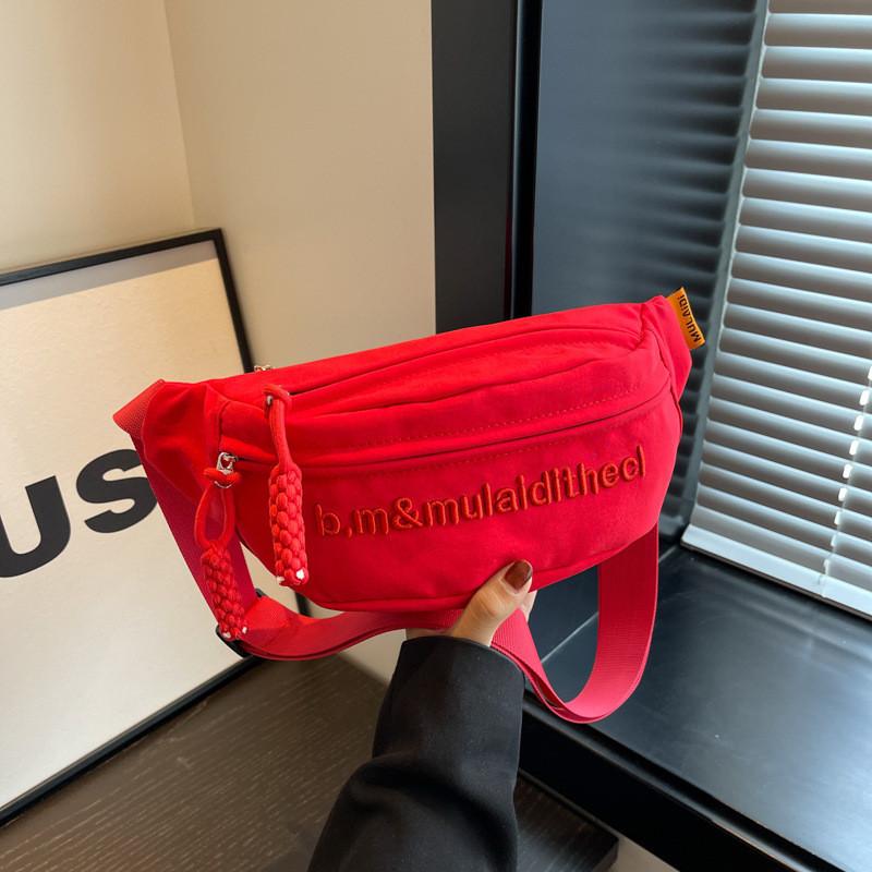 Versatile Water-resistant Canvas Crossbody Bag With Letter Print Perfect For Travel And Casual Use