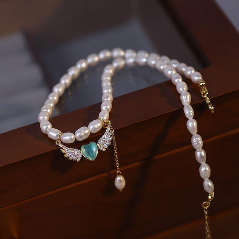 

Blue Heart & Angel Wing Pearl Necklace for Women