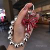 Butterfly love round bead mobile phone chain ins fashion women's hand chain wrist pendant bead pendant bag pendant