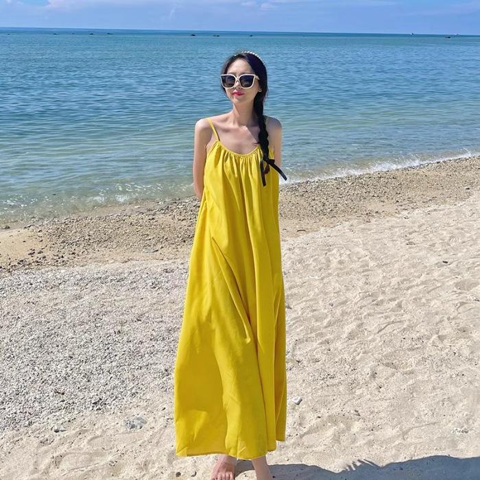 

Seaside vacation sexy backless suspender dress women s summer new loose a-word skirt gentle yellow long skirt S