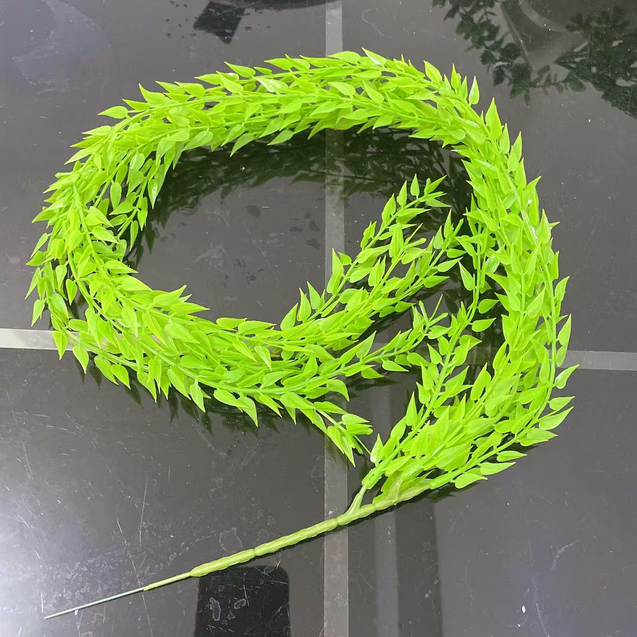 

Hanging Wicker Wreath with Rattan, Faux Flowers, and Green Leaves