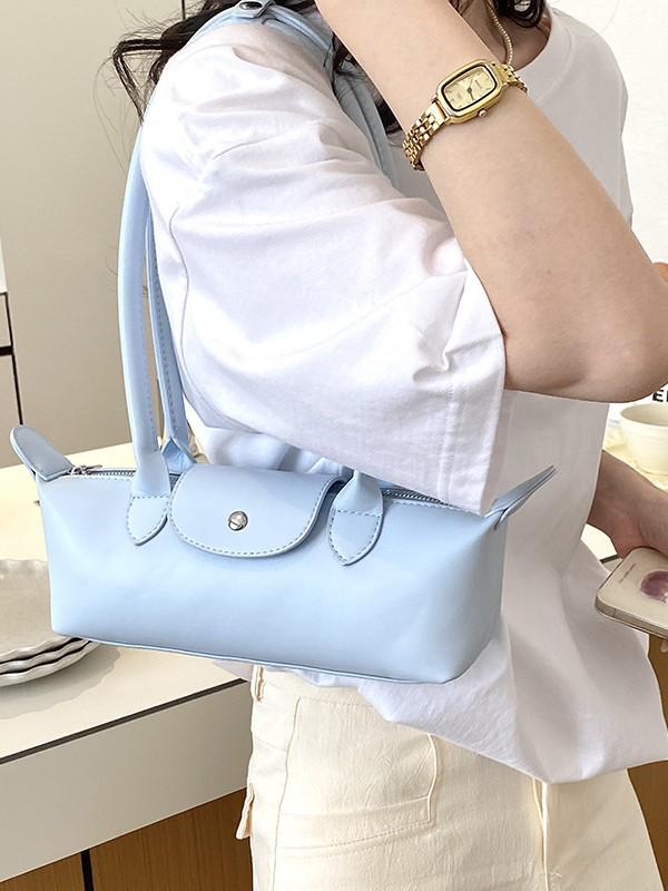2026 French Light Luxury Cowhide Long Handle Dumpling Baguette Crossbody Bag