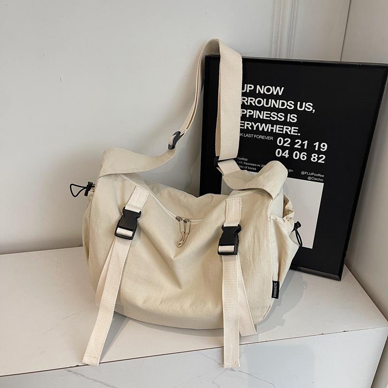 Niche design simple solid color 2025 casual spring fashion lazy style casual female college student messenger tote bag