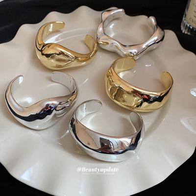 Irregular Geometric Polished Open Bangle: European-American Style Statement Bracelet with Exaggerated Elegance.