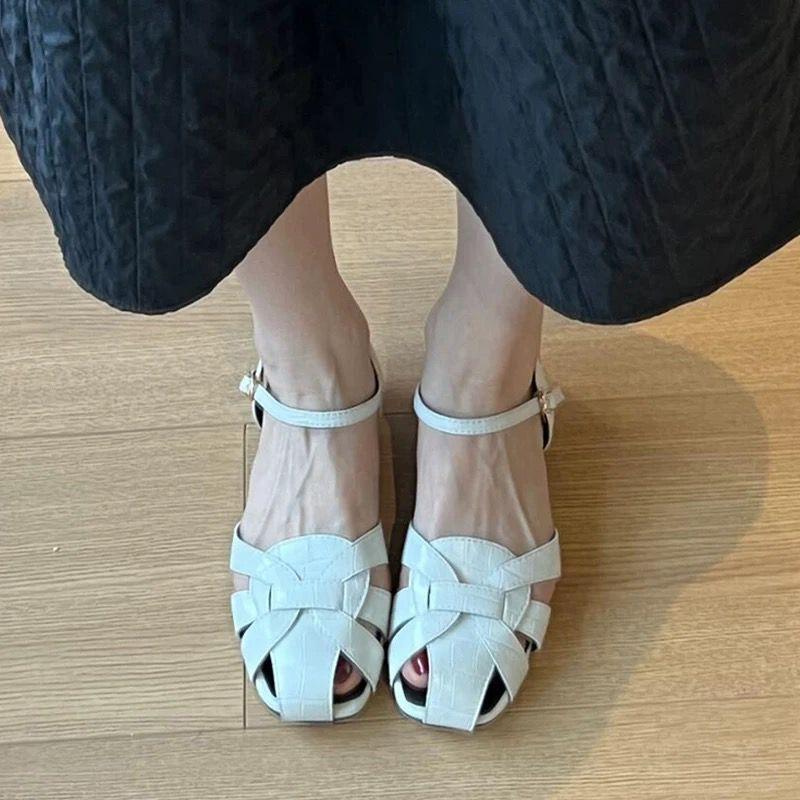 Cowhide version~ woven hollow breathable low-heeled sandals women's one-word bag head shoes flat pig cage shoes
