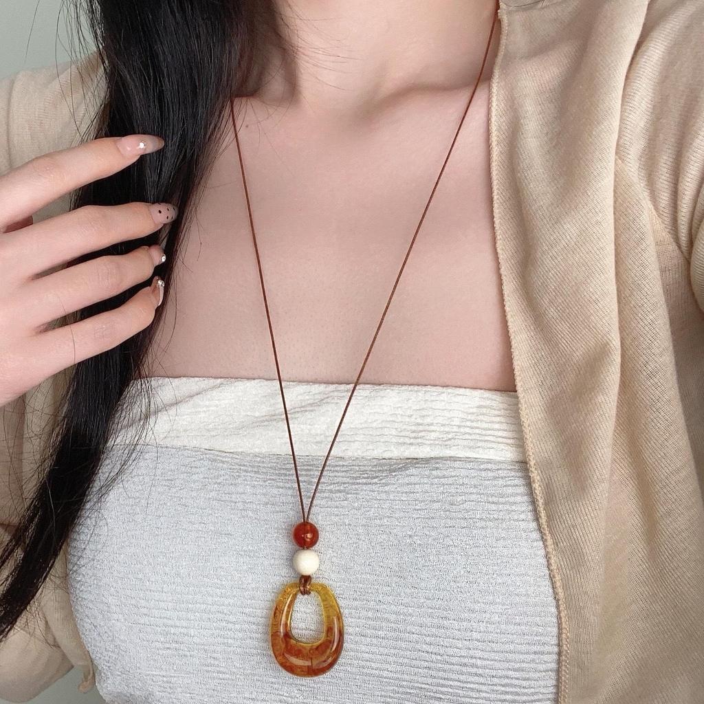 "Ethnic-Style Black Rope Ring Pendant Necklace - New Chinese Design for Autumn & Winter"