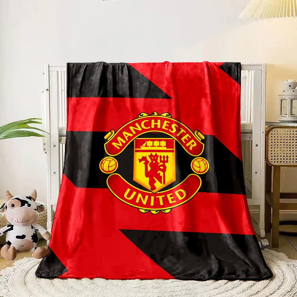 Diagonal red and black zigzag pattern with a central Manchester United logo. for all seasons blanket lunch break throw gift