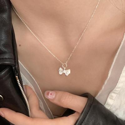 Charming Christmas Bow Pendant Necklace: Simple, Frosted Clavicle Chain for Women - Autumn Light Luxury Choker