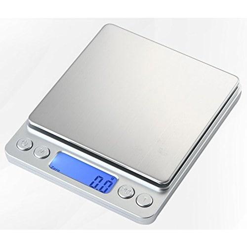 Compact, precision digital scale with 0.1g increments, weighs up to 3kg, includes Japanese instruction manual and two weighing trays