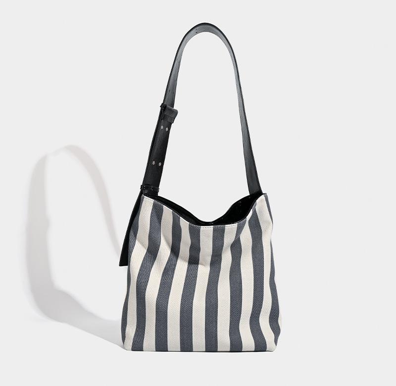 

Textured women s bag 2025 new niche tote bag large capacity striped commuter canvas hand-to-shoulder crossbody women s bag