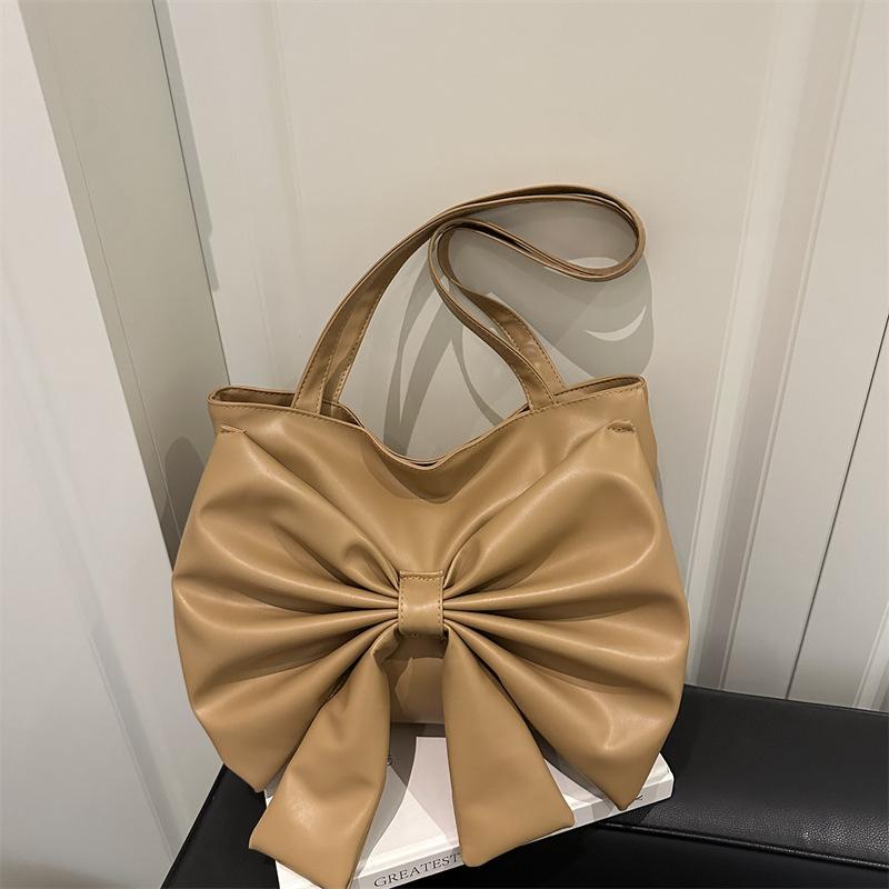 Niche fashion foreign shoulder bag 2025 summer new Korean version girl bow commuter tote bag