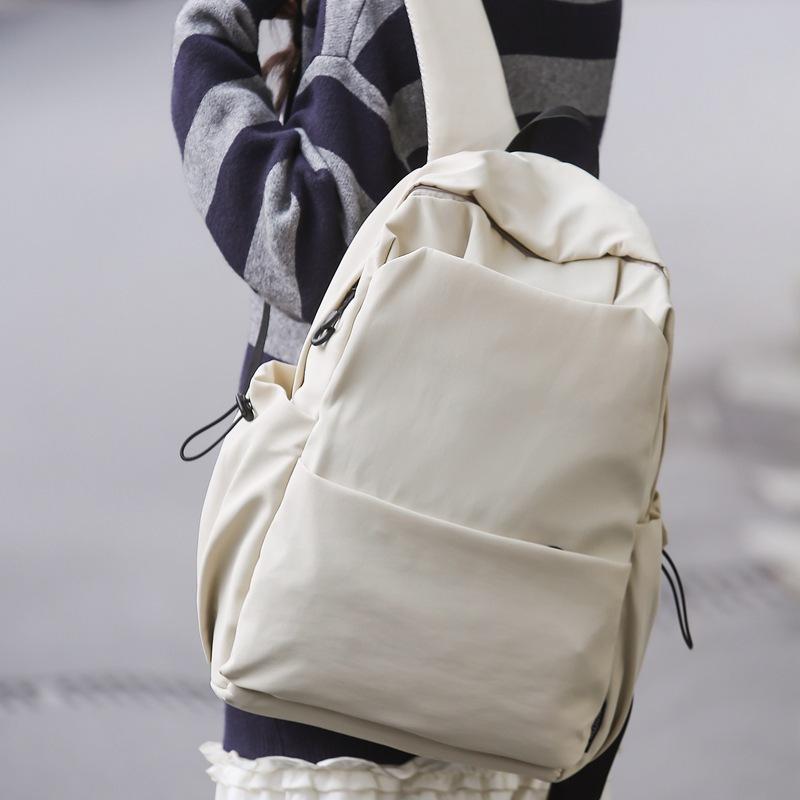 Schoolbag new large-capacity high-value junior high school student casual schoolbag Japanese and Korean version solid color fashionable simple