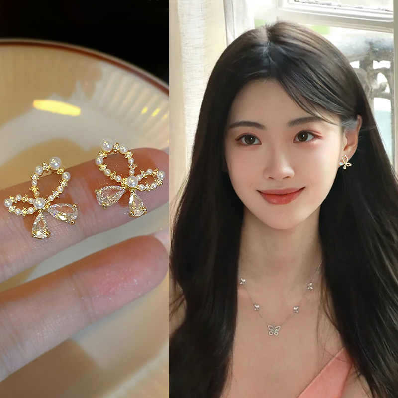 French light luxury temperament gold asymmetric pearl bow stud earrings design sense daily versatile temperament earrings
