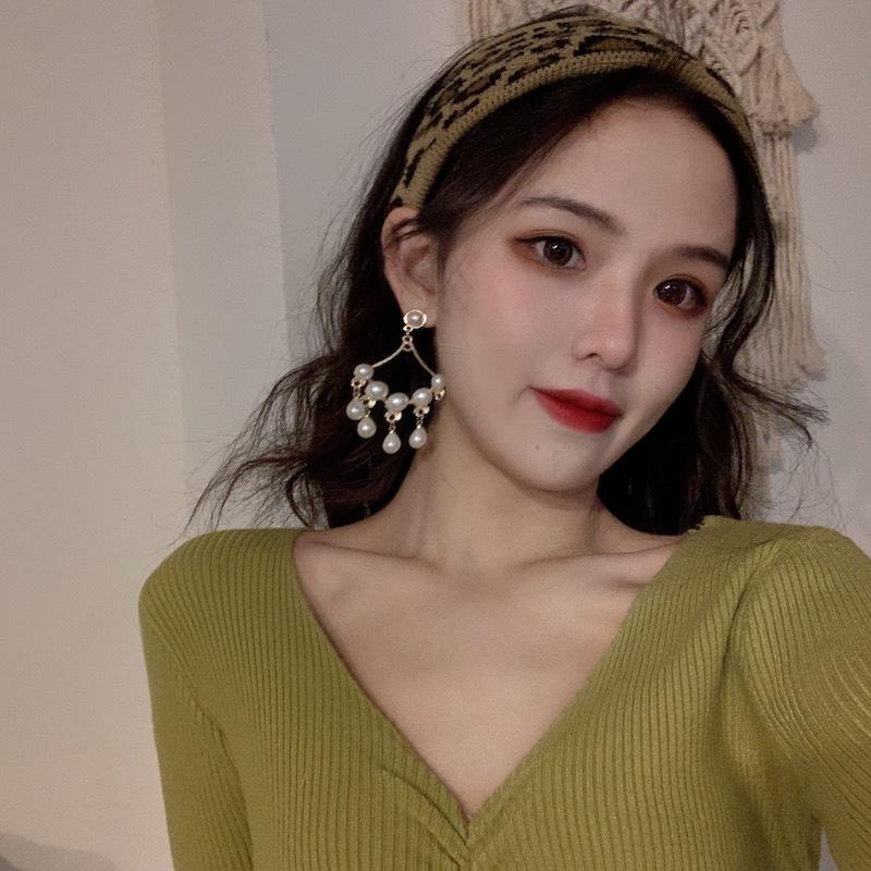 Otoño Invierno mujer cuello en V Color sólido manga larga plisado parte inferior de punto suéter elegante