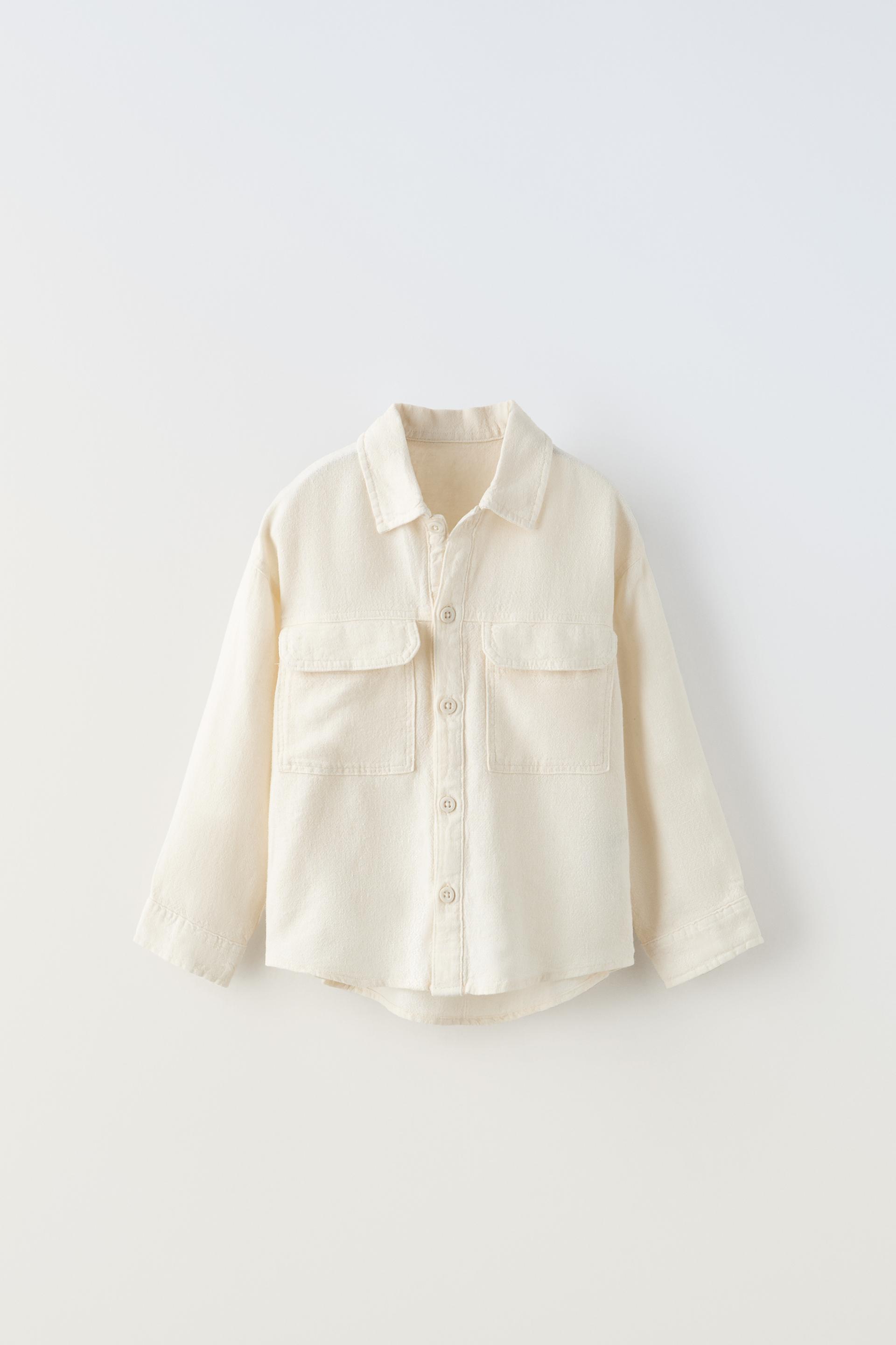 

СТРУЯЩАЯСЯ РУБАШКА С КАРМАНАМИ