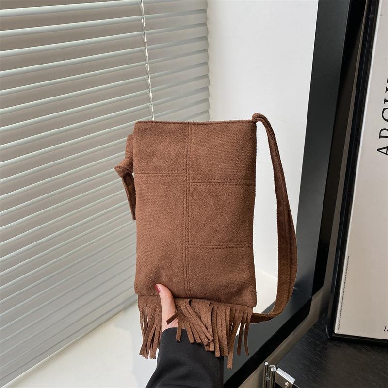 Niche design new women's bags spring and summer retro simple trend fringed single shoulder messenger bag vertical mobile phone bag
