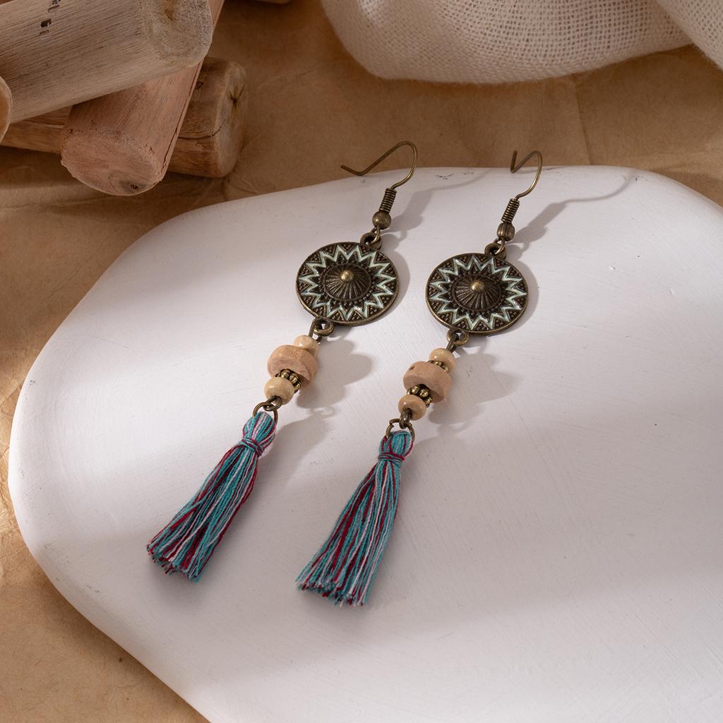 Retro ethnic style woven feathers long fringed earrings, bohemian high-end hollow rice bead earrings