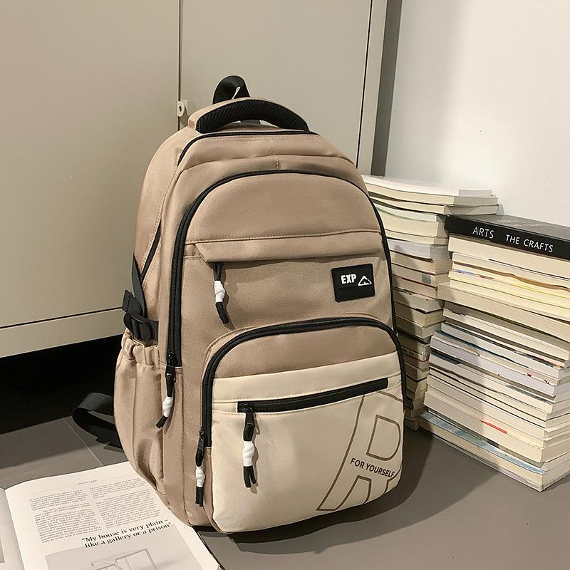High value trendy cool letter backpack couple contrasting colors simple and lightweight travel mountaineering backpack