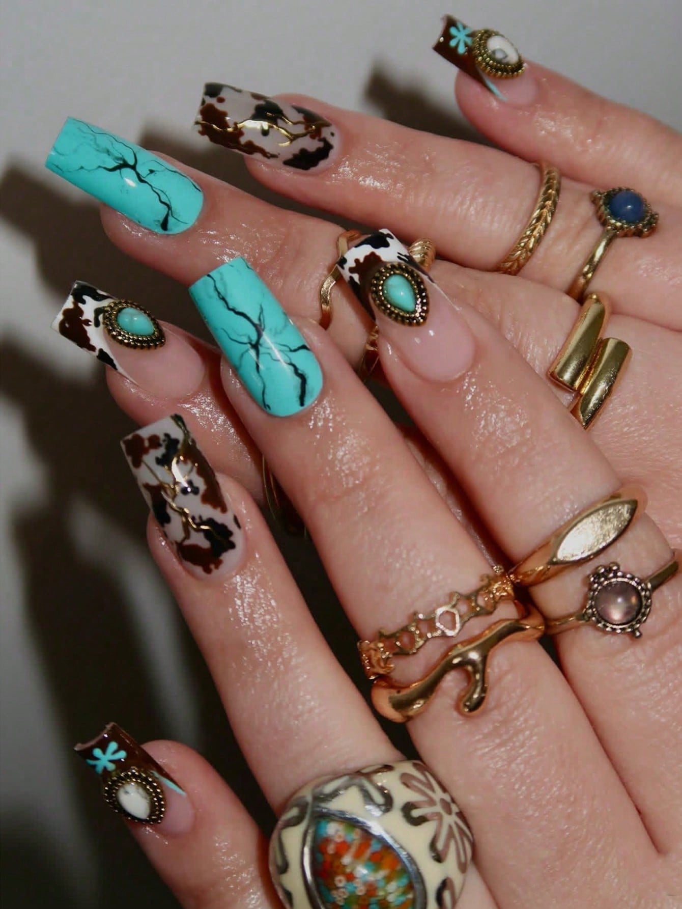 24 square nail art gift box, Western cowboy style, milk pattern, mixed with retro diamond fashion sense, turquoise blue color scheme. Square