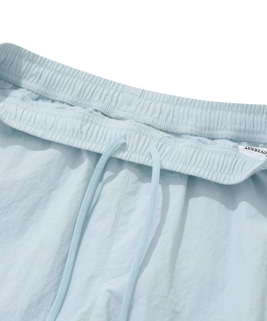 COVERNAT WOMAN Sheer Nylon Windbreaker Shorts Light Blue