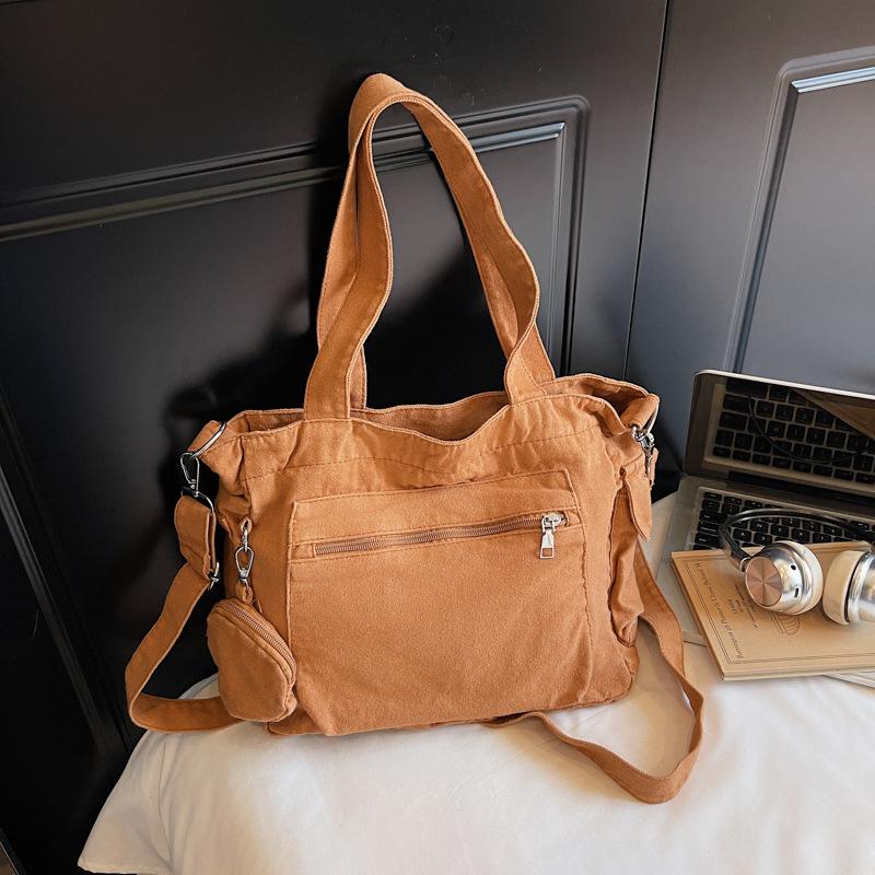 

Красивая сумка-тоут, женская, трендовая, портативная, на плечо, 2025 новая, простая однотонная, большой вместимости, сумка-мессенджер коричневый