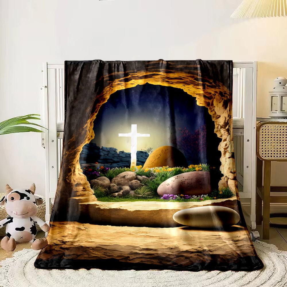 

A glowing cross is visible through a rocky tomb entrance with flowers. for all seasons blanket lunch break throw gift 80cm x 120cm