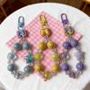 Handmade Beaded Phone Lanyard Keychain with Cute Bow, Lip Gloss Charm, and High-End Bag Pendant