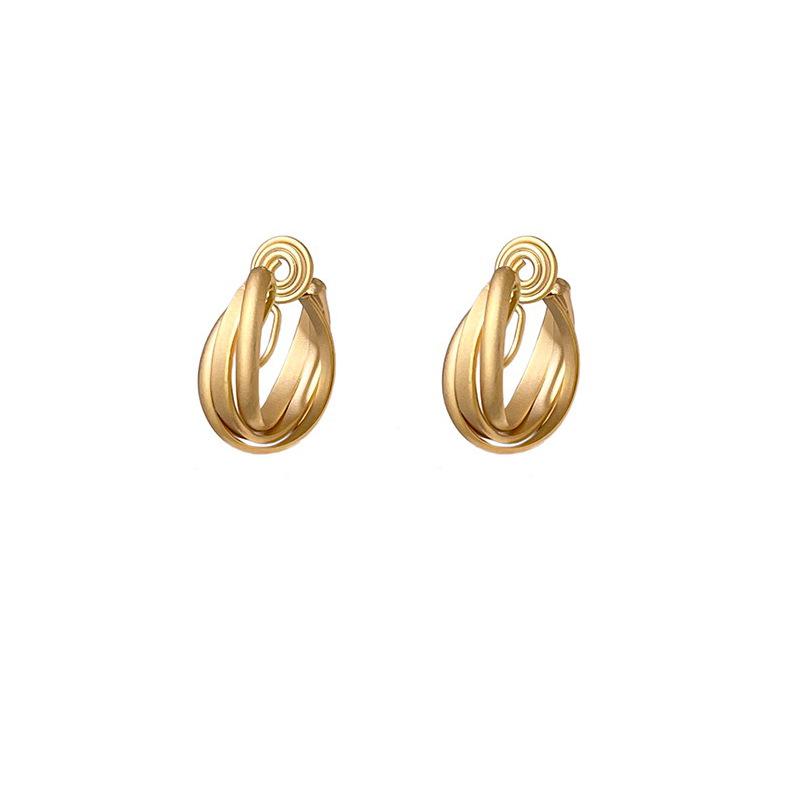 Gold twist metal mosquito coil plate earrings, women's light luxury temperament circles, high-end earrings, niche, no ear clips.