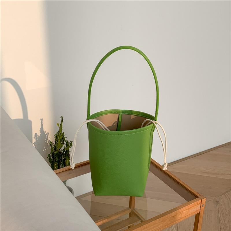 

Retro bag summer versatile solid color shoulder armpit bag women s niche cylinder portable bucket bag women зелений