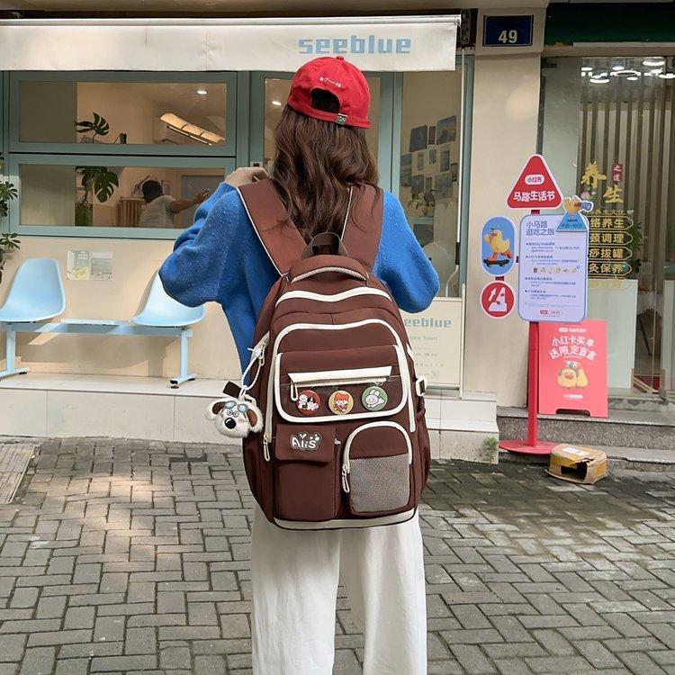 Schoolbag new junior high school student high school student schoolbag large capacity primary school student burden reduction ridge protection high