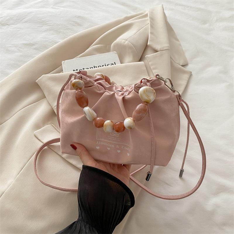 

Высококлассная модная повседневная сумка женская 2025 новая весна и лето портативная универсальная маленькая квадратная сумка корейская версия нишевый мессенджер розовый