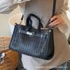 High-end cut-out handheld tote bag for women 2025 new fashion design large-capacity commuter mother-in-law bag crossbody bag