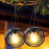 Solar Wrought Iron Lantern Light: Retro Mesh Pendant for Outdoor Garden, Courtyard, and Balcony Ambiance.