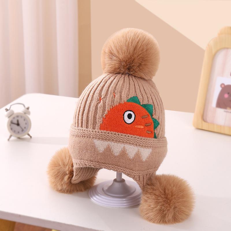 A children's dinosaur wool hat winter new cartoon jacquard knitted hat medium and older boys and girls ear hats
