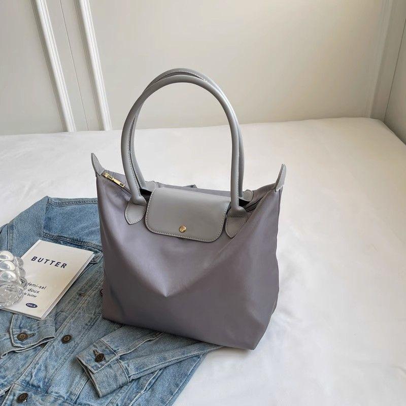 

Ultra-light and dirt-resistant gray bag, new commuter tote bag, large-capacity shopping bag, mommy bag, teacher travel bag. single package серый