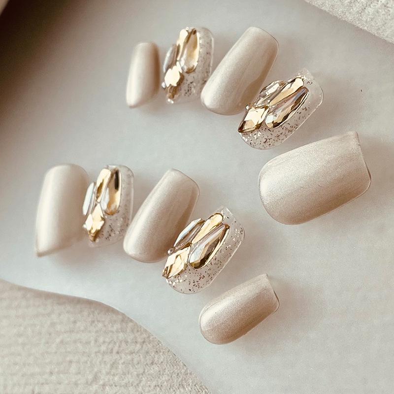 

Jingyue Si Handmade Nude Rhinestone Press-on Nails - Light Luxury Manicure Stickers in Milk Tea Color with Cat Eye Tips Extra Small