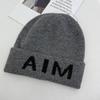 Niche personalized letter knitted hat children's autumn and winter new wool hat warm ear protector bag head cold hat