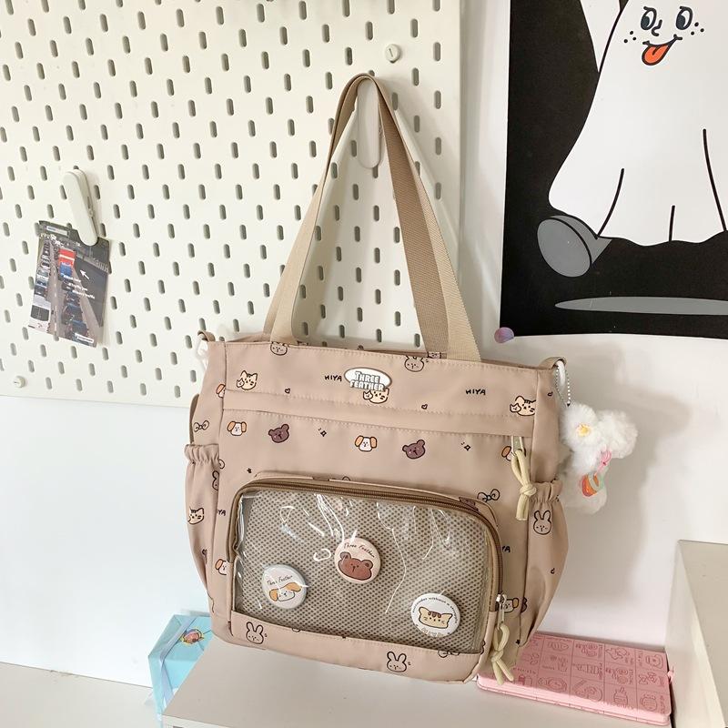 

School bag autumn new simple fashion campus junior high school students large capacity backpack cute cartoon shoulder tote bag women single package