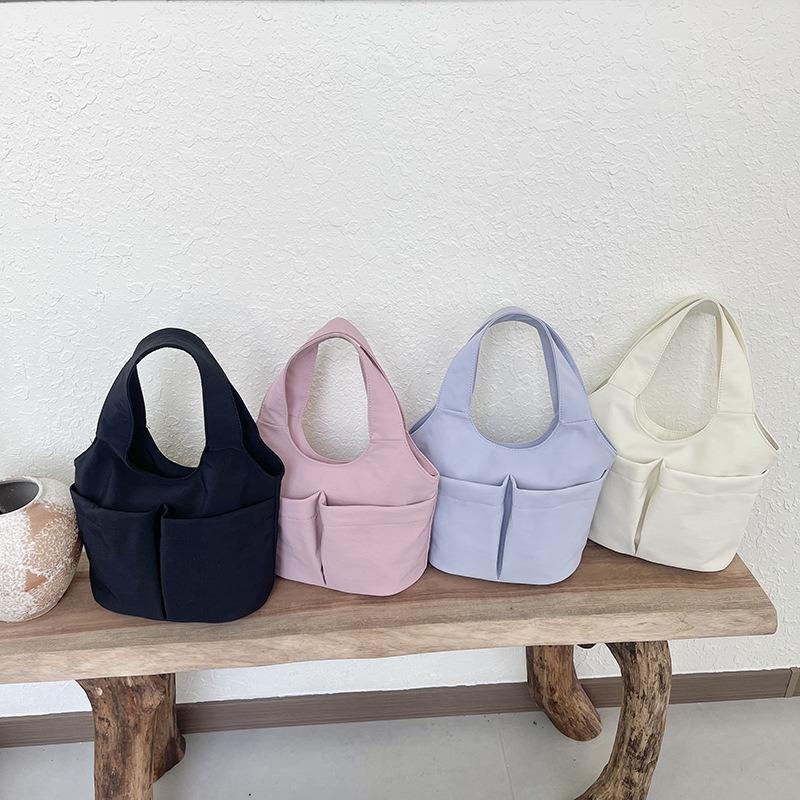 Women's casual simple solid color multipocket summer new fashion go out portable handbag